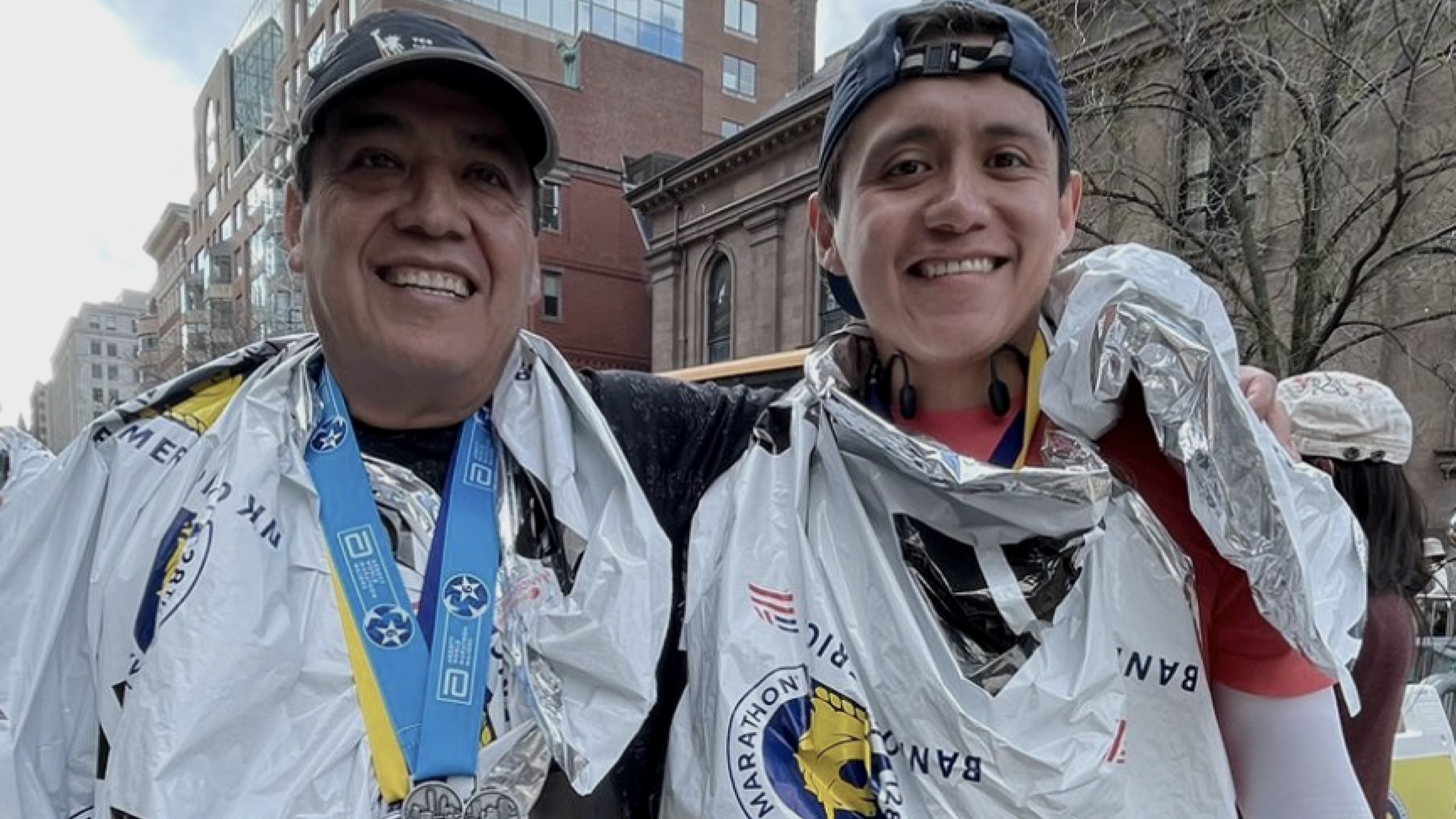 Omar and his father at the Boston Marathon finish line